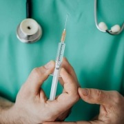 Person Holding A Vaccine
